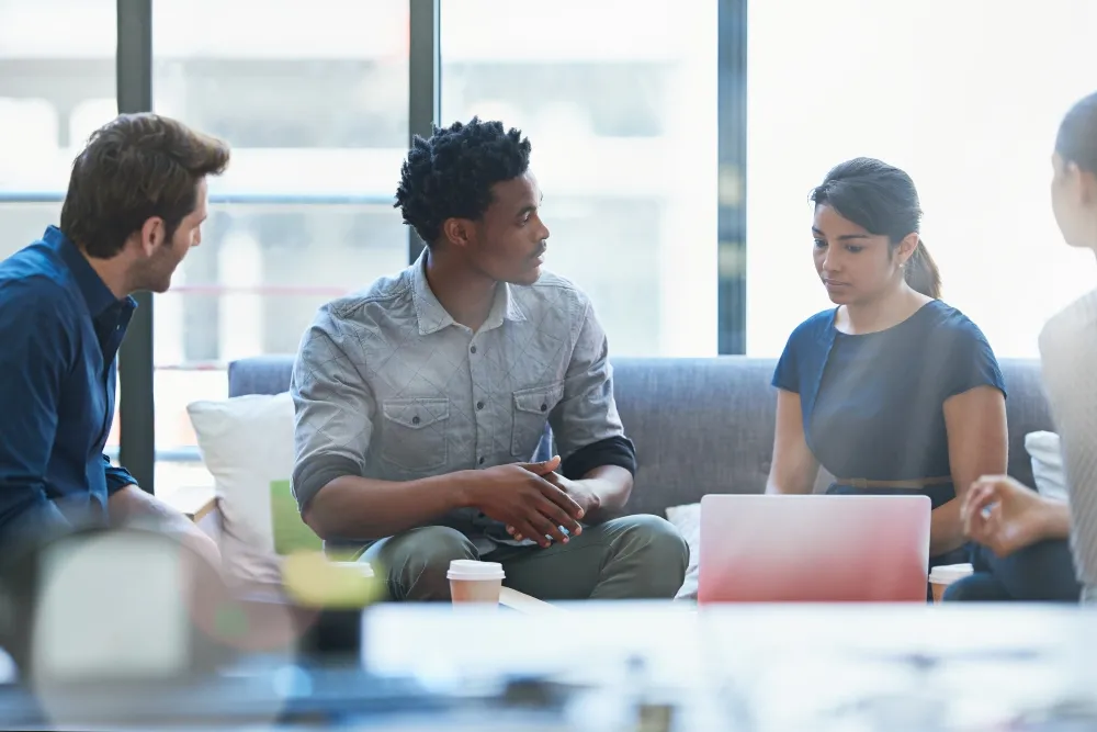 Man talking to his clients in his office
