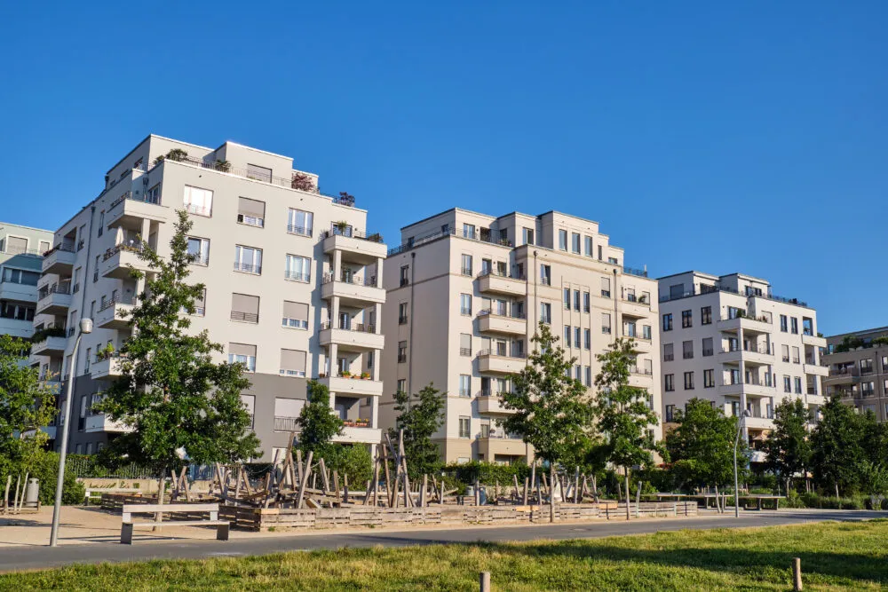 Modern apartment buildings overlooking park and playground