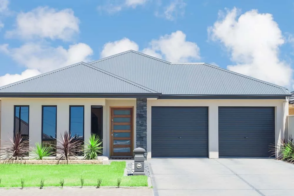 Modern single-storey home with double garage and lawn