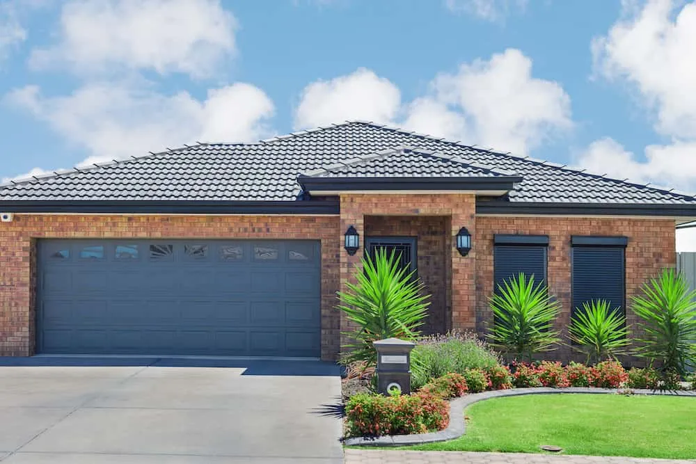 Modern brick home with double garage and garden